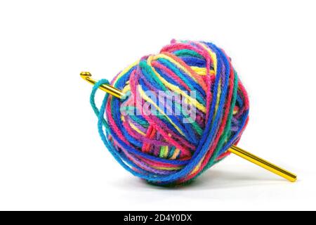 crochet hook in colorful ball of yarn isolated on white background Stock Photo