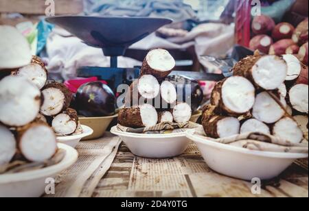 Sliced yuca roots or manihot esculenta, traditional food in Latin America, in plates on a local market in Merida, Yucatan, Mexico Stock Photo