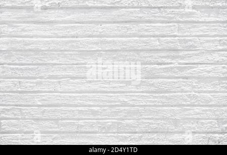 Light black and white brick wall from and urban building in the city with light highlights Stock Photo