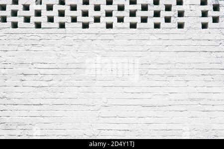 Light black and white brick wall from and urban building in the city with light highlights Stock Photo