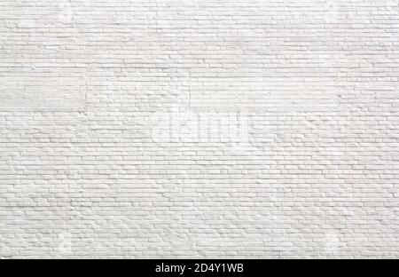 Light black and white brick wall from and urban building in the city with light highlights Stock Photo