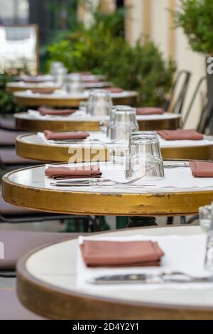Ourdoor cafe with empty tables set for a meal Stock Photo