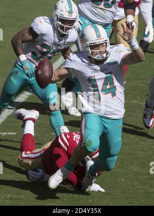 Miami Dolphins defensive end Ryan Baker (90), Miami Dolphins linebacker  Micah Johnson (57) and Miami Dolphins defensive tackle Travis Ivey (62)  during the second half of an NFL preseason football game against