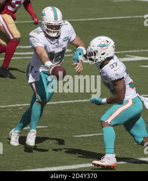 Miami Dolphins quarterback Ryan Fitzpatrick (14) throws during minicamp ...