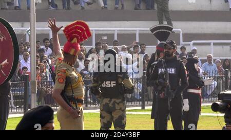 AMRITSAR, INDIA - MARCH 19, 2019: soldiers issue challenges and face off at the wagah border in amritsar, india Stock Photo