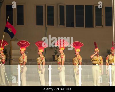 AMRITSAR, INDIA - MARCH 19, 2019: indian soldiers on a balcony at the start of the closing ceremony at wagah border in amritsar, india Stock Photo