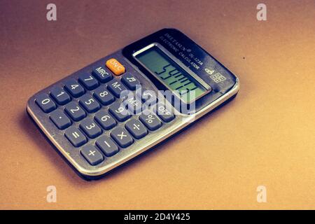 Electronic calculator device  for  calculations with a keyboard and display Stock Photo