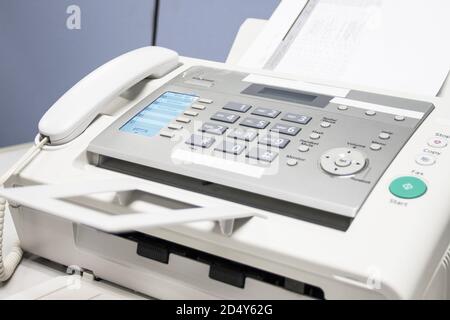 The fax machine use for Sending documents in the office, concept equipment needed in office Stock Photo