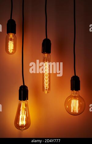Set of vintage light bulb on orange background. Glowing edison bulb Stock Photo