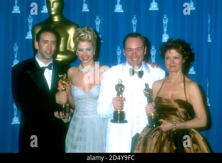 Los Angeles, California, USA 25th March 1996 (L-R) Best Actor Winner Nicolas Cage ('Leaving Las Vegas'), Best Supporting Actress Winner Mira Sorvino ('Mighty Aphrodite'), Best Supporting Actor Winner Kevin Spacey ('The Usual Suspects') and Best Actress Winner Susan Sarandon ('Dead Man Walking:) pose with their Oscars in press room at the 68th Annual Academy Awards at Dorothy Chandler Pavilioin on March 25, 1996 in Los Angeles, California, USA. Photo by Barry King/Alamy Stock Photo Stock Photo