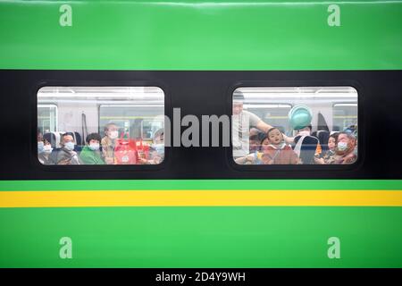 Beijing, China. 11th Oct, 2020. Passengers are seen in a high-speed train in southwest China's Chongqing, Oct. 11, 2020. Credit: Tang Yi/Xinhua/Alamy Live News Stock Photo