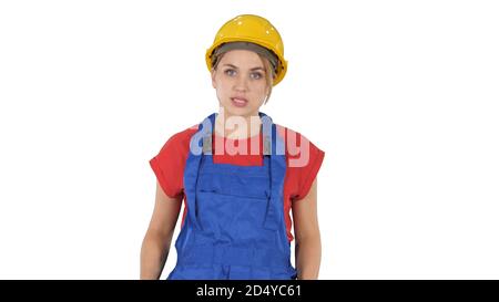 Woman in construction outfit talking to camera while walking on Stock Photo