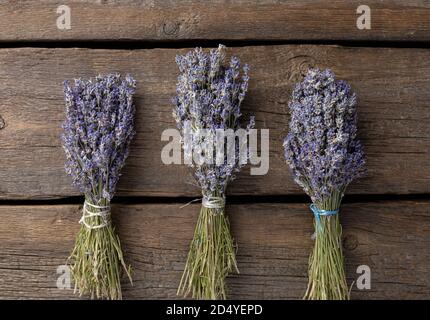 dried lavender in bunches on a wooden table Stock Photo