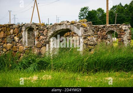 Stone ruins of an abandoned old building on the farm. Stock Photo