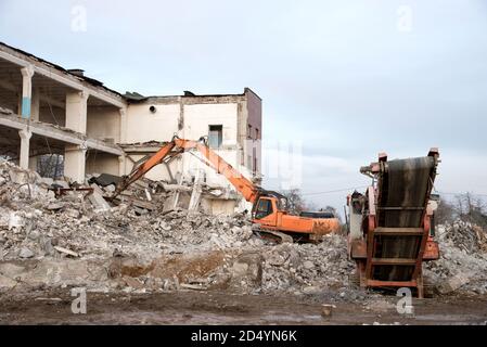 High Reach Excavator machines for demolition of tall building. Machine ...