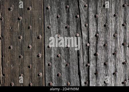 old medieval weathered door with rusty nails Stock Photo