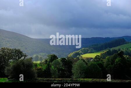 storm clouds over landscape at rhayader, wales Stock Photo