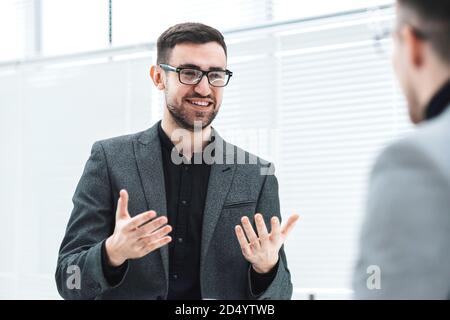 attractive young employee explaining his ideas to a colleague Stock Photo