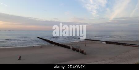 Panoramic view at the north sea from the german island wangerooge. sunset illuminates the evening sky Stock Photo