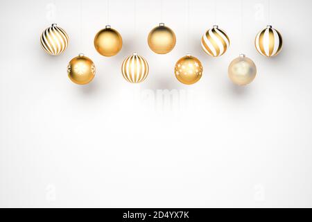 Golden and white Christmas Baubles with different designs hanging in ...
