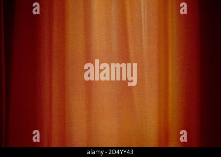 Behind closed curtains, wrinkled window blinds as background Stock Photo