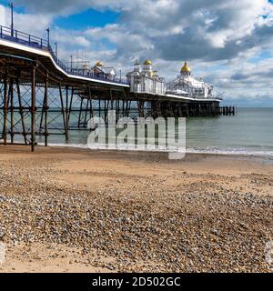 Eastbourne Pier completed in 1872 is 300 metres long. Built on stilts that rest on cups on the sea bed. Allowing the pier to move in bad weather. Stock Photo