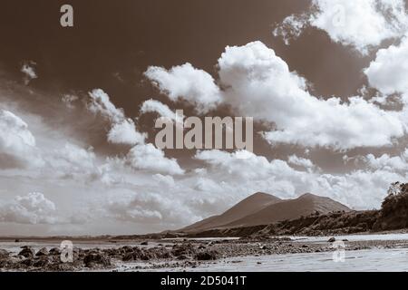 Old Head beach on the west coast looking towards the mountain of Croagh Patrick at Louisburgh, County Mayo, Ireland Stock Photo