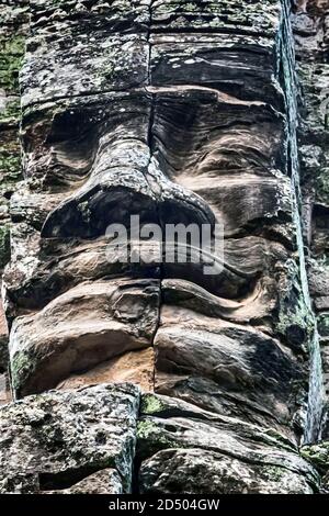 Stone bas relief smiling Buddha face Stock Photo
