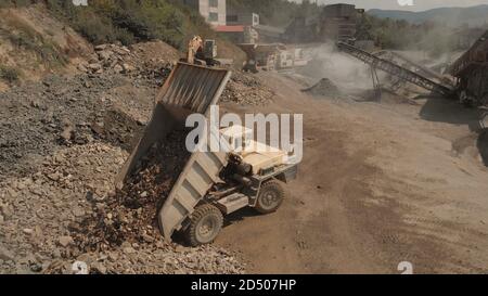 Truck unloads stones in a pile. Stock Photo