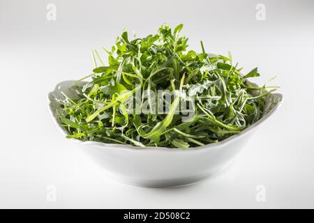 Bowl full of salad leaves on an isolated background Stock Photo