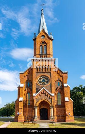 Naglowice, Swietokrzyskie / Poland - 2020/08/16: Neo-gothic parish church of St. Mary Rosary near park and historic museum manor house of Mikolaj Rej, Stock Photo