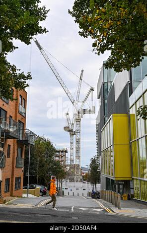 Cranes on the Edward Street Quarter new homes development construction site Brighton East Sussex UK Stock Photo