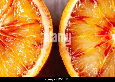 Close up macro of fresh organic Sicilian blood oranges sliced. Stock Photo