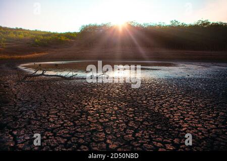 Lake on the verge of extinction after a dry summer . Ecological drought disaster Stock Photo