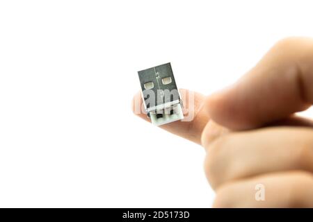 A white USB type C charger cable, compatible for many devices, wrapped in a spiral shape, isolated on white background. Stock Photo