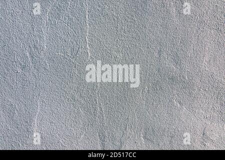 Grey concrete wall background texture. Grunge uneven rough plaster cement gypsum wall outdoors Stock Photo