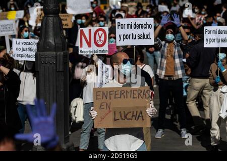 Madrid, Spain. 12th Oct, 2020. Nurses with placards during a protest in Sol Square. Nurses are demanding better working conditions and protesting against the management of the coronavirus crisis in the public health care system. Credit: Marcos del Mazo/Alamy Live News Stock Photo