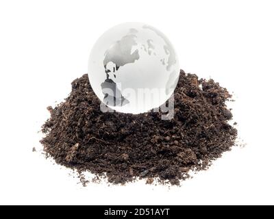 Glass ball with soil isolated on white background Stock Photo