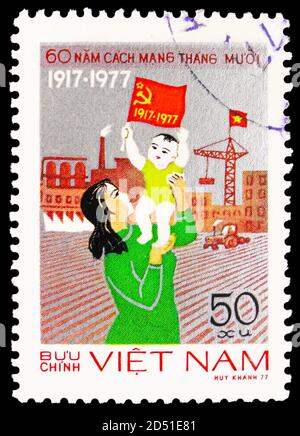 MOSCOW, RUSSIA - SEPTEMBER 28, 2020: Postage stamp printed in Vietnam shows Happiness, 60th Anniversary of the Great Socialist October Revolution seri Stock Photo