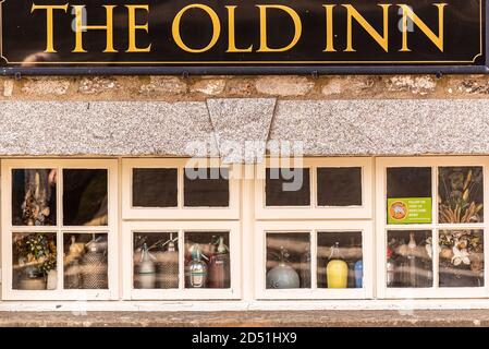 Old pub with soda siphons, The Old Inn, Widecombe-in -the-Moor, Dartmoor, Devon,UK Stock Photo