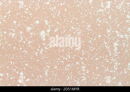 Decorative plaster. Finishing off cream-color painted wall by particle white plaster. Textured background Stock Photo