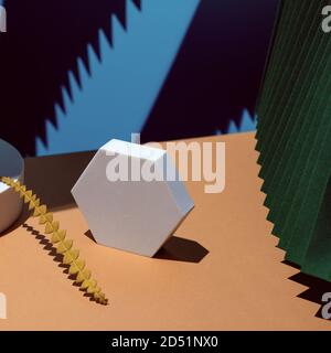 Composition of geometric shapes and colored fans made of cardboard. Concept. Stock Photo