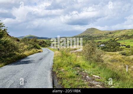 Single lane country road in Derrymore, County Mayo, Ireland Stock Photo