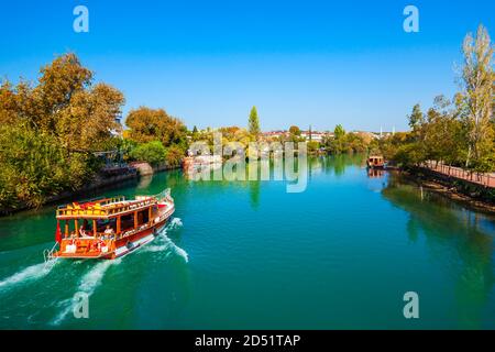 Tourist cruise boat at Manavgat river in Manavgat city centre in Antalya region in Turkey Stock Photo