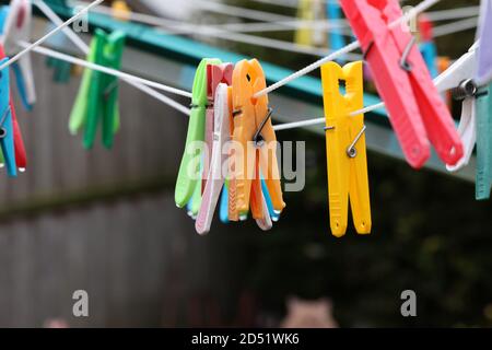 Close up of a colored clothespins on a clothesline Stock Photo