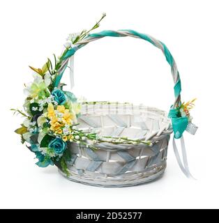 Festive basket with a flower arrangement on white background Stock Photo