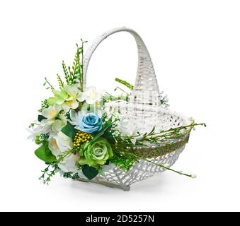 Festive basket with a flower arrangement on white background Stock Photo