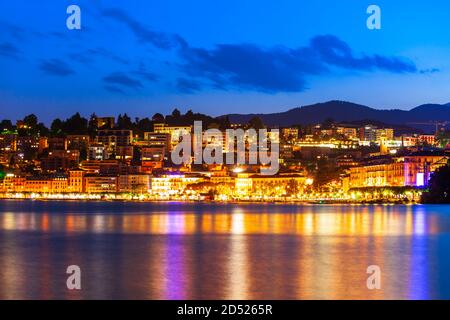 Lugano lake and Lugano city panoramic view in canton of Ticino in Switzerland at night Stock Photo