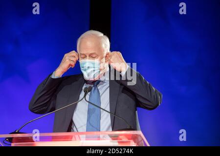 Austin TX USA, Oct. 9 2020: U.S. Sen. John Cornyn wears a face mask as he takes the stage at a debate against Democratic challenger MJ Hegar. Cornyn, a Republican stalwart, has held the seat since 2002. Stock Photo