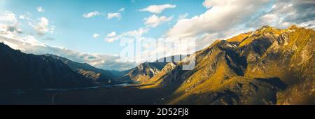 Panoramic shot of beautiful autumn mountain landscape at sunset, aerial view Stock Photo